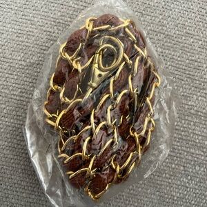 Gold chain with brown leather strap